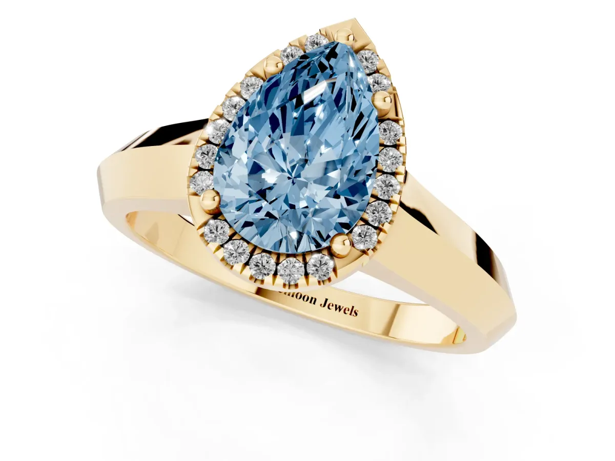 Fancy Blue Pear Cut Halo Diamond Ring with Cathedral Band and Four-Prong Setting Yellow gold