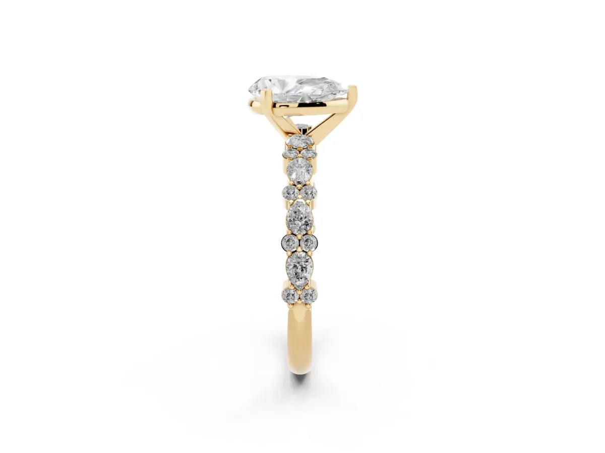Pear Cut Diamond Side Stone Solitaire Ring with Round and Four-Prong Setting Yellow gold