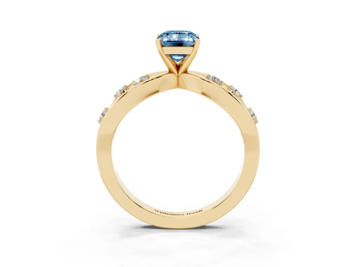 Fancy Blue Emerald Cut Cut Solitaire Diamond with Side Stones on Criss-Cross Band and Four-Prong Setting Yellow gold