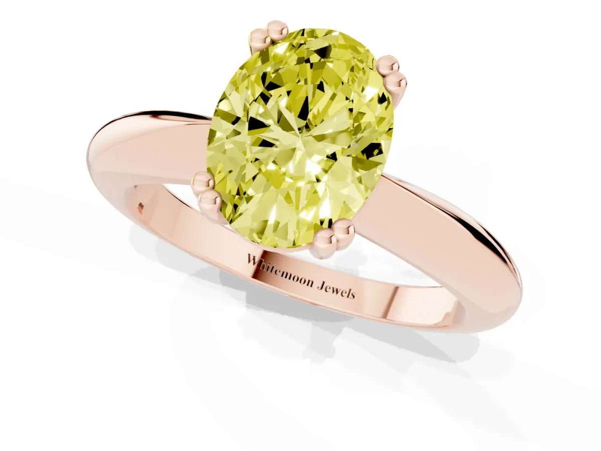 Fancy Yellow Oval Cut Cut Solitaire Engagement Ring with Tapered Band and Four-Prong Setting Rose gold