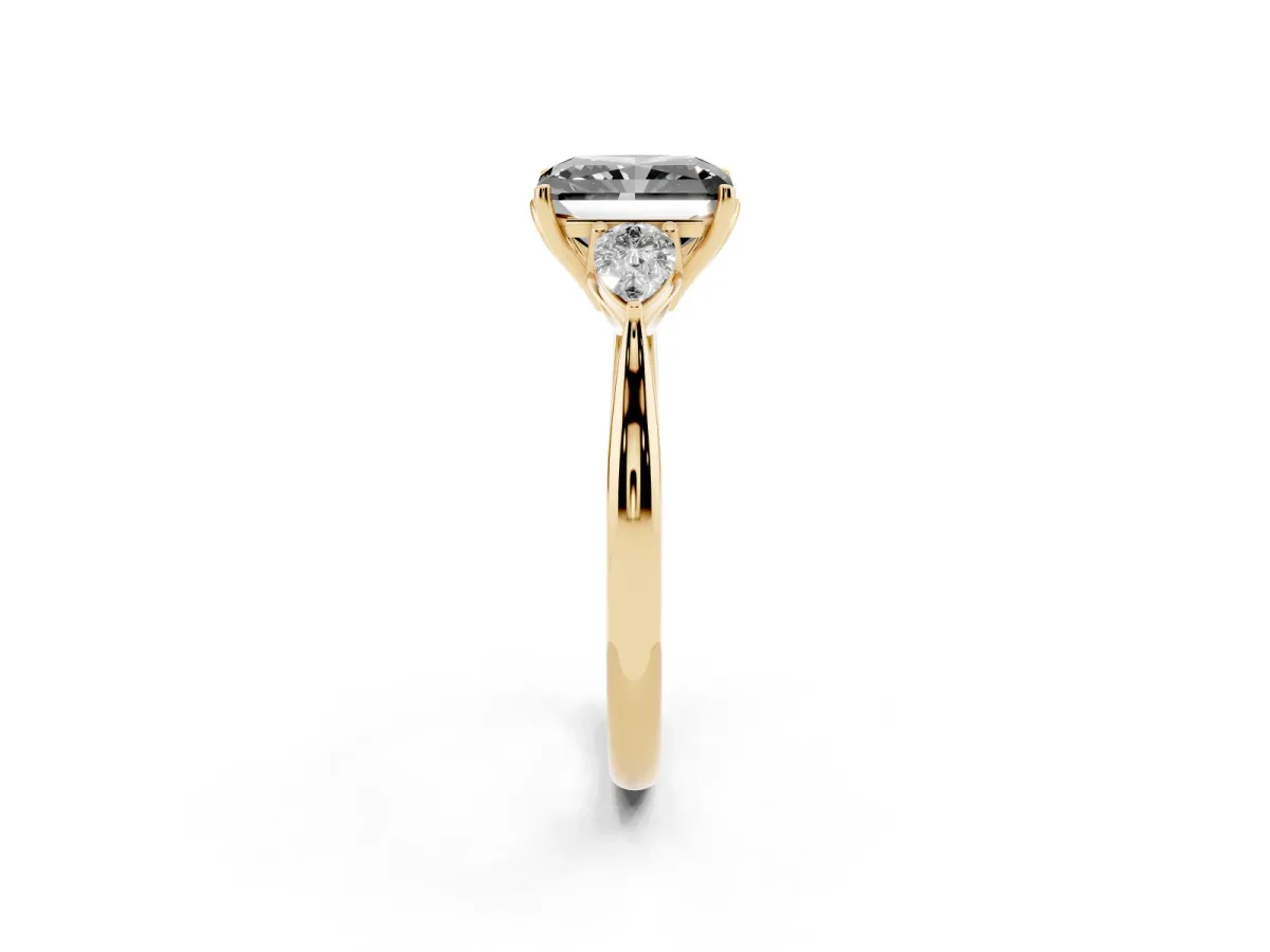 Fancy Black Three-Stone Radiant Cut Brilliant Diamond Solitaire Ring with Tapered Band and Four-Prong Setting Yellow gold