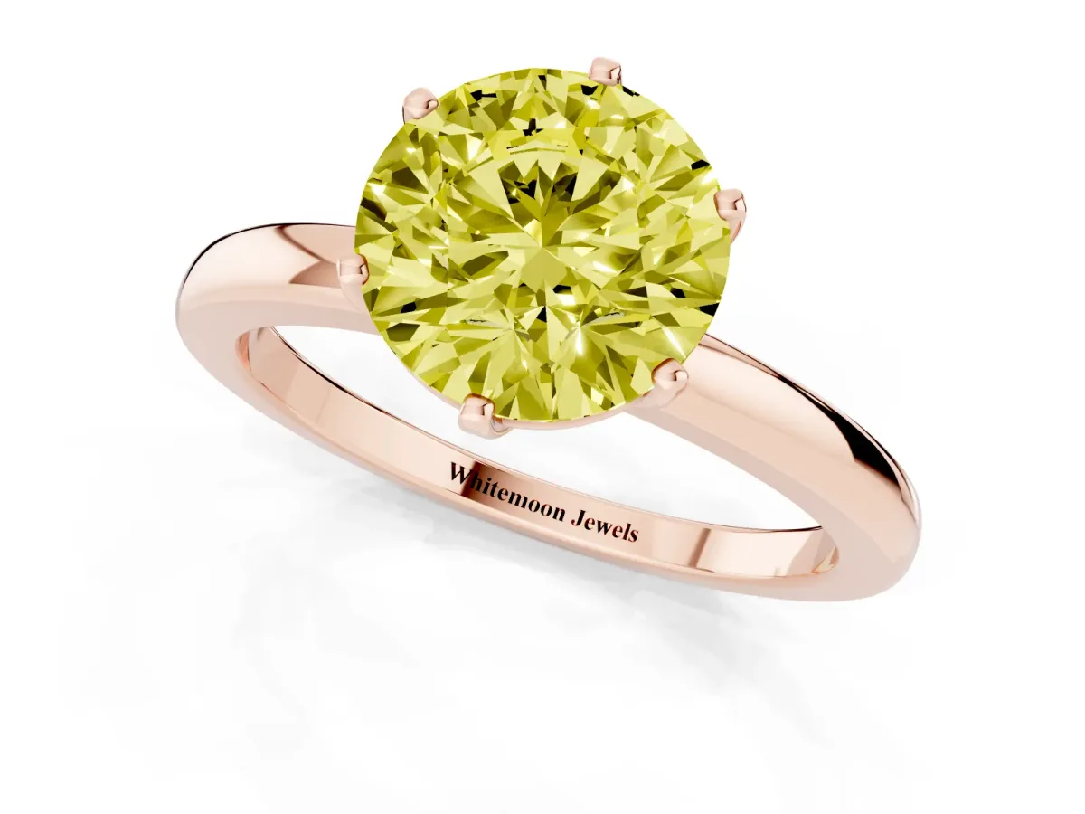 Fancy Yellow Round Cut Solitaire Diamond Ring with Six-Prong Setting on a Classic Band Rose gold