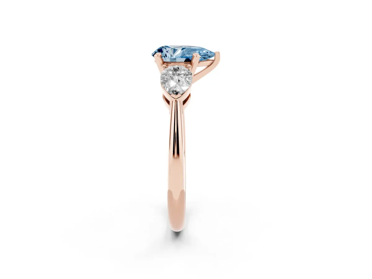 Fancy Blue Three-Stone Pear Cut Diamond Ring with Pear Side Stones and Four-Prong Setting Rose gold