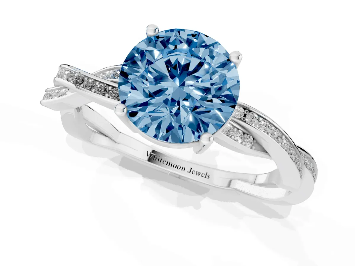 Fancy Blue Round Cut Solitaire Twisted Pave Diamond Ring with Four-Prong Setting Silver