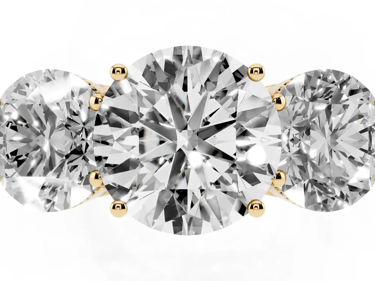 Three-Stone Round Cut Diamond Engagement Ring with Prong Setting on a Classic Band Yellow gold