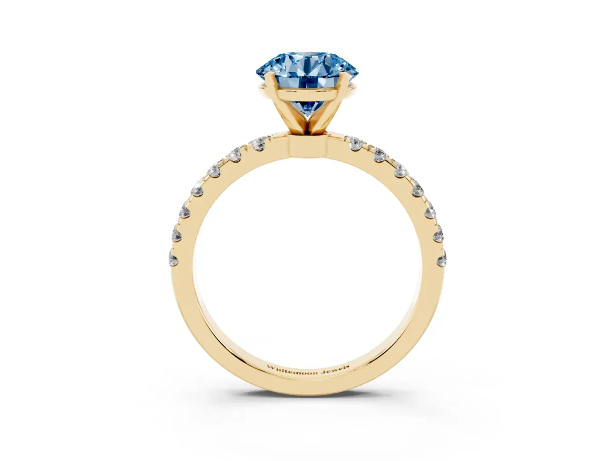 Fancy Blue Round Cut Diamond Solitaire Ring with Pavé Accents and Four-Prong Setting Yellow gold