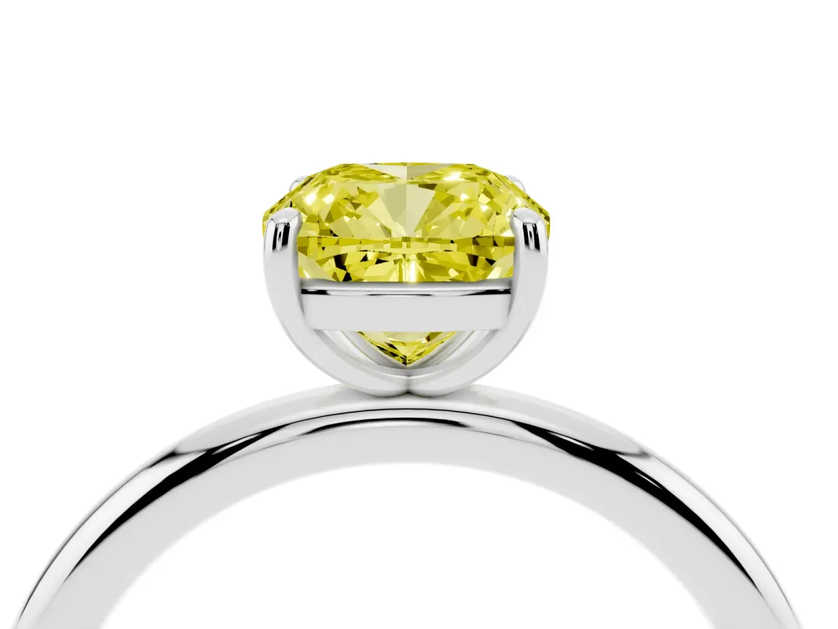 Fancy Yellow Cushion Cut Solitaire Diamond Ring with Four-Prong Setting on a Plain Band Silver