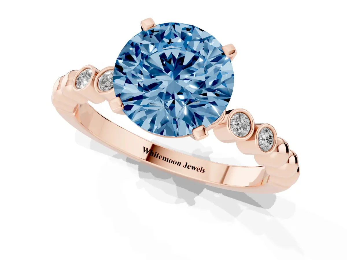 Fancy Blue Round Cut Solitaire Bezel Accent Diamond Engagement Ring with Beaded Band and Four-Prong Setting Rose gold