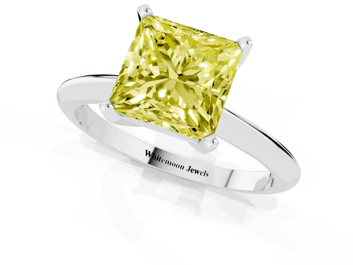 Fancy Yellow Princess Cut Cut Solitaire Ring with Four-Prong Setting on a Classic Band Silver