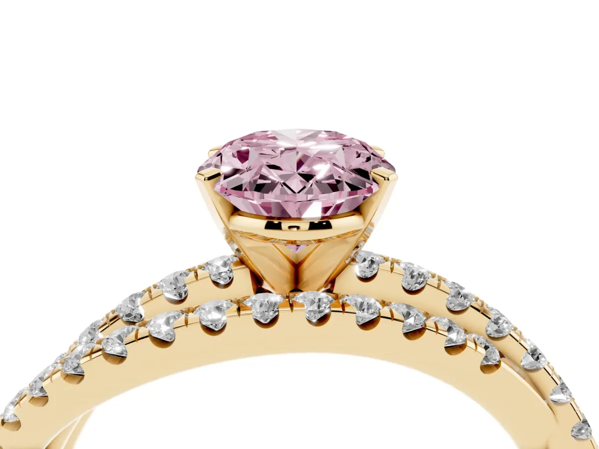 Fancy Pink Oval Cut Solitaire Twist Band with Pavé Setting and Four-Prong Setting Yellow gold