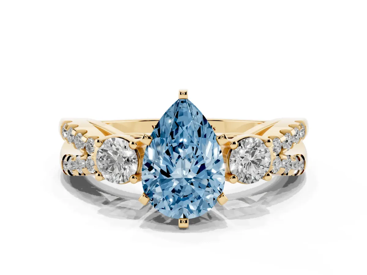 Fancy Blue Pear Cut Diamond Three-Stone Ring with Pavé Split Shank and Four-Prong Setting Yellow gold