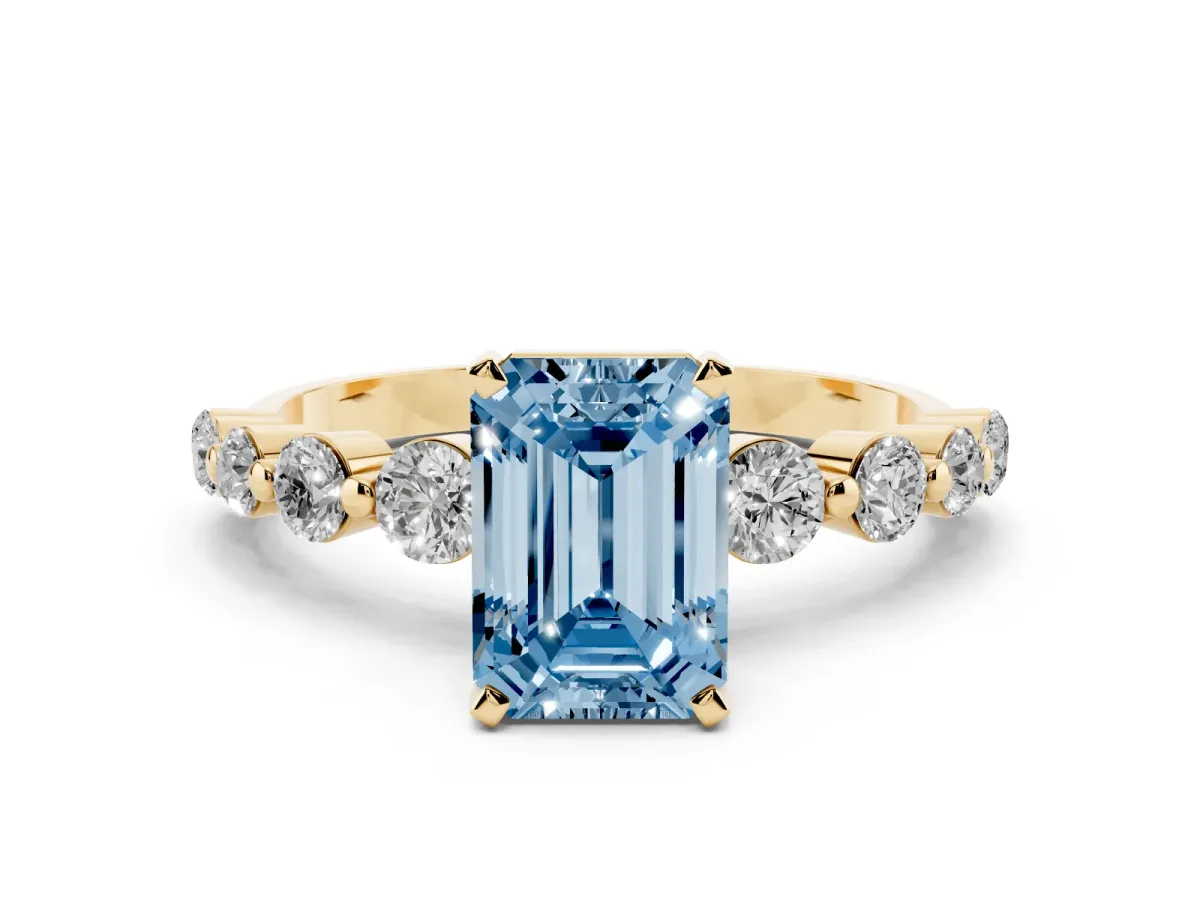 Fancy Blue Emerald Cut Solitaire Diamond Ring with Pave Band and Four-Prong Setting Yellow gold