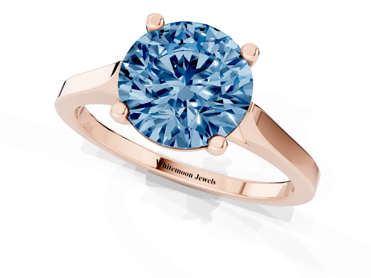 Fancy Blue Round Cut Solitaire Diamond Ring with Four-Prong Setting and Tapered Band Rose gold