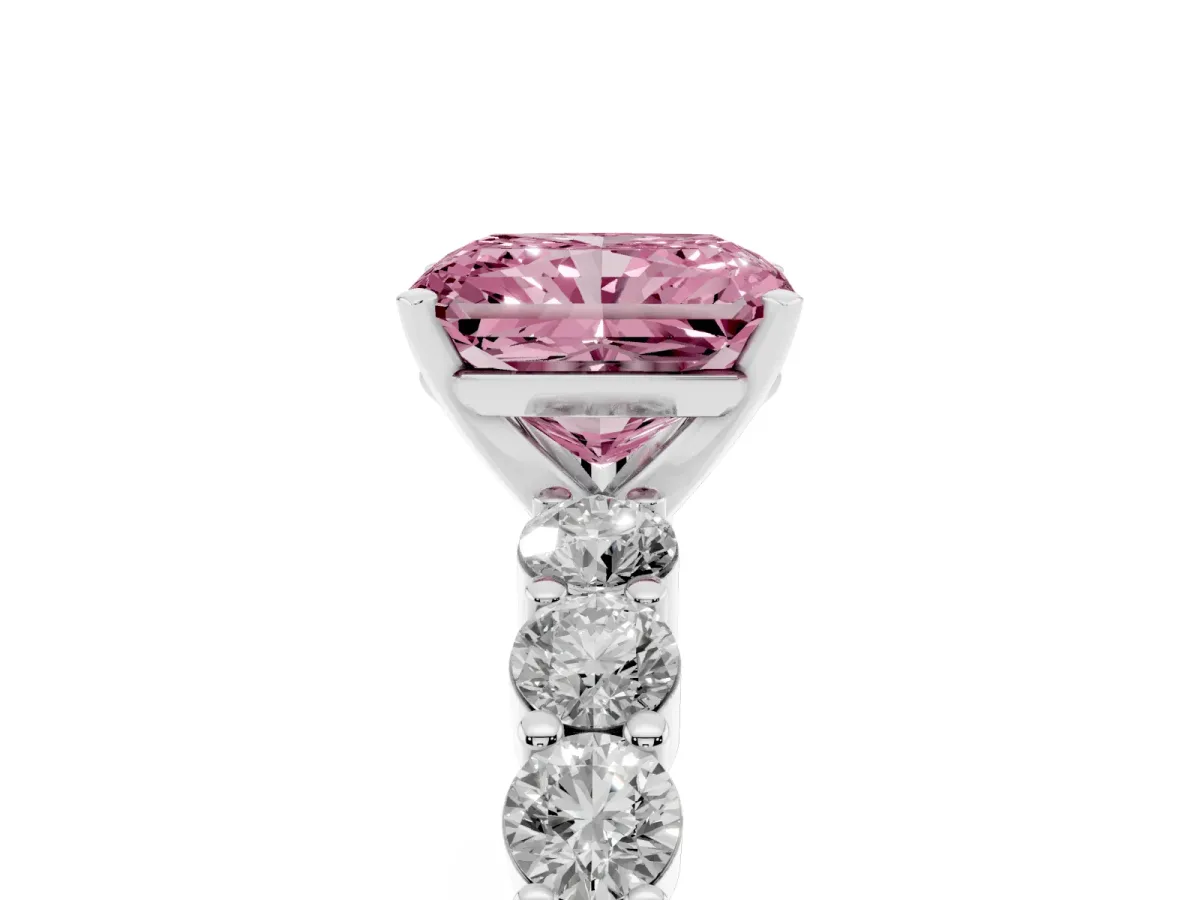 Fancy Pink Radiant Cut Diamond Solitaire Ring with Shared Prong Round Side Stones Platinum