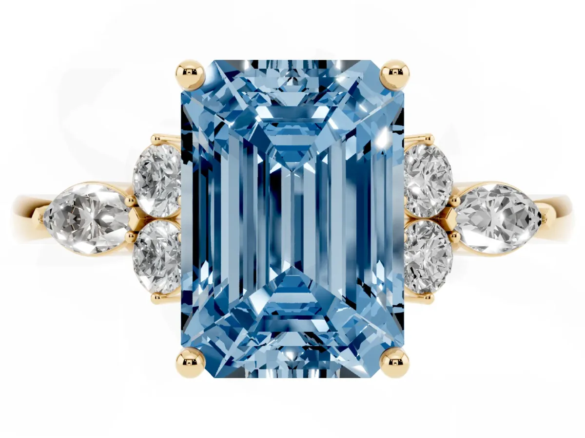 Fancy Blue Emerald Cut Brilliant Diamond Solitaire Ring with Pear Side Stones and Four-Prong Setting Yellow gold