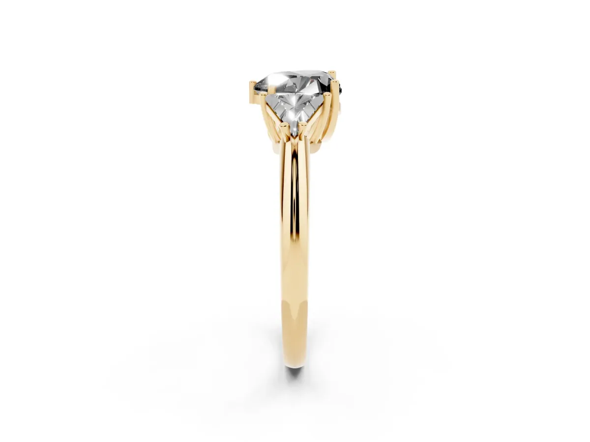 Fancy Black Three-Stone Heart Cut Diamond Engagement Ring with Trillion Side Stones and Prong Setting Yellow gold