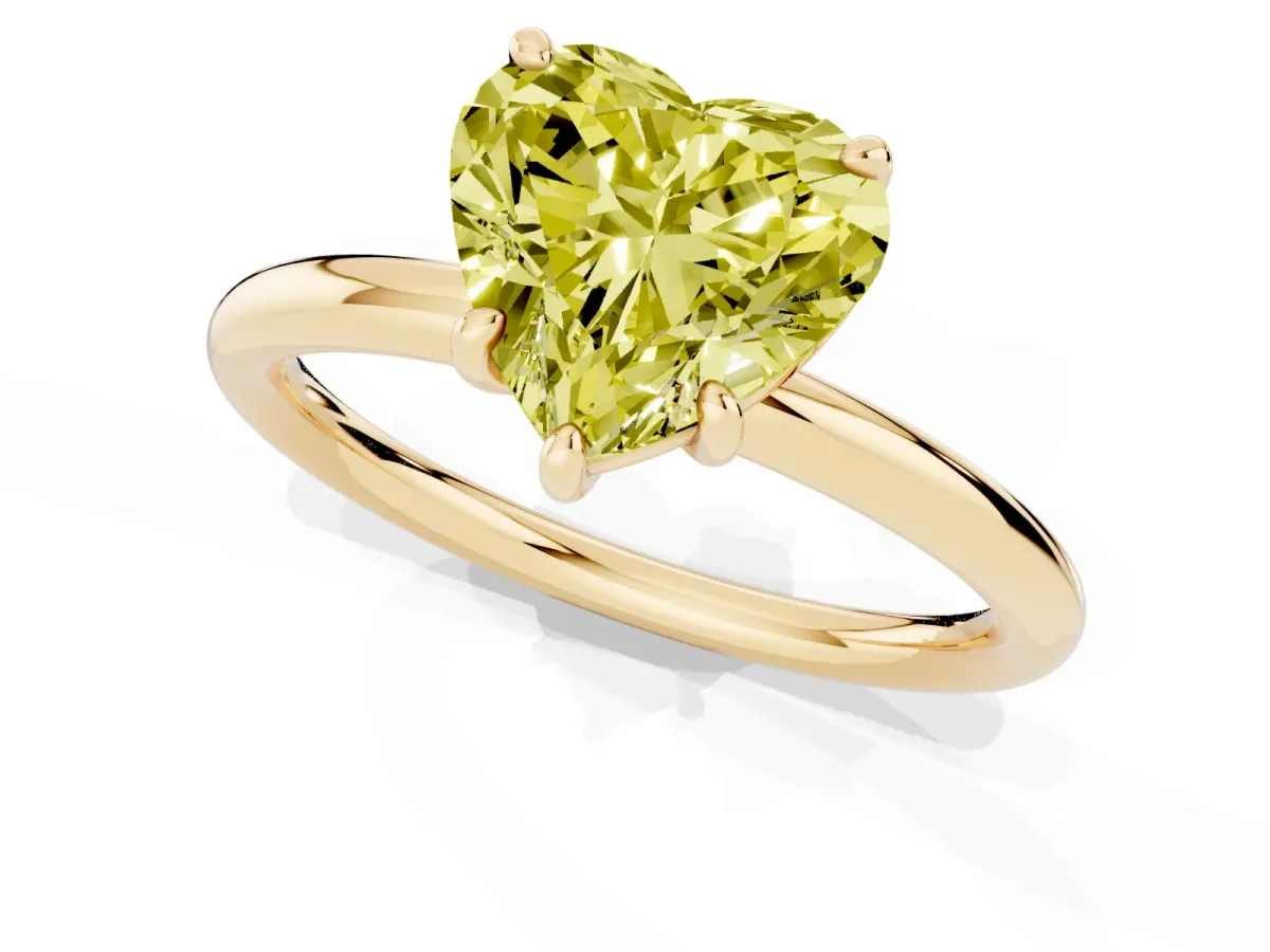 Fancy Yellow Heart Cut Solitaire Diamond Ring with Four-Prong Setting on a Plain Band Yellow gold