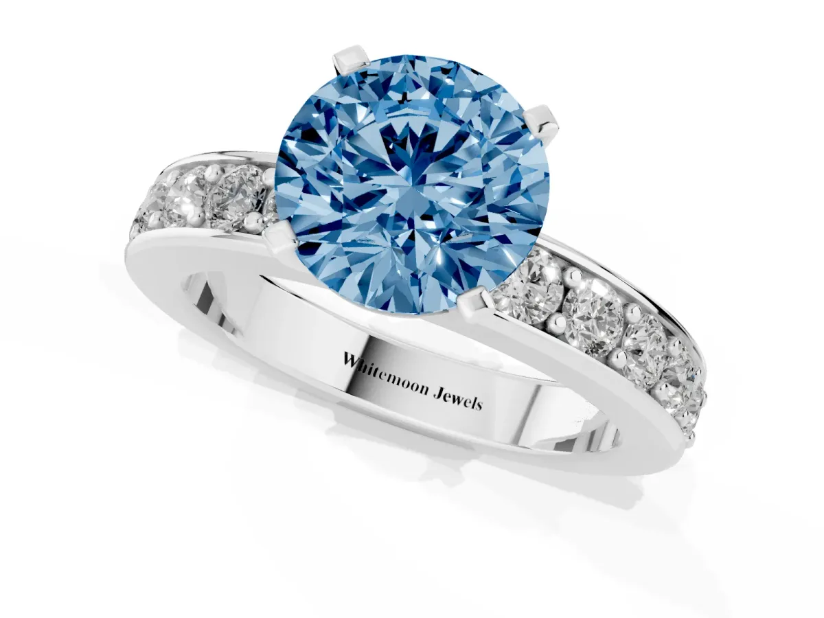 Fancy Blue Round Cut Diamond Engagement Ring with Channel Set Round Band and Prong Setting White gold