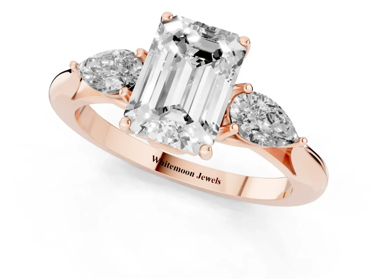 Emerald Cut Diamond Three-Stone Ring with Pear Side Stones and Prong Setting Rose gold