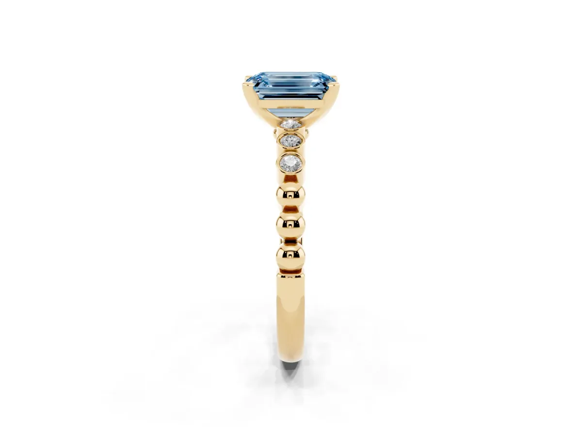 Fancy Blue Emerald Cut Solitaire Bezel Accent Diamond Engagement Ring with Beaded Band and Four-Prong Setting Yellow gold
