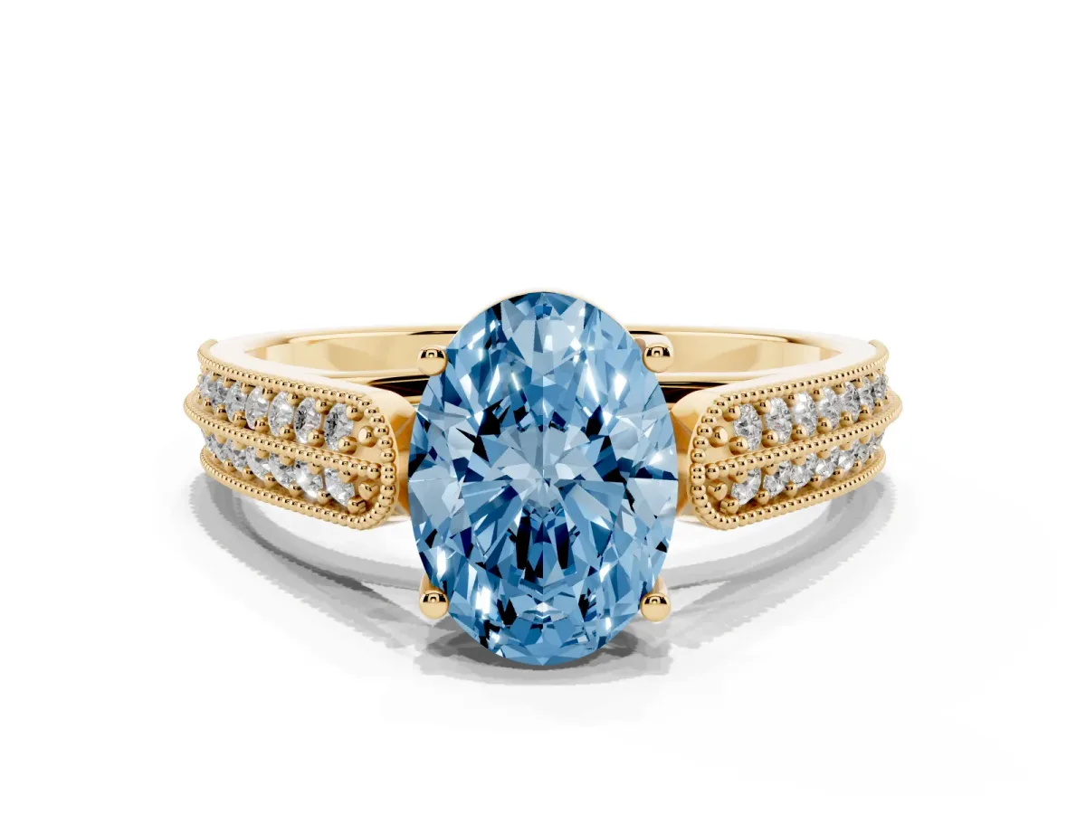 Fancy Blue Oval Cut Cut Pave Split Shank Engagement Ring with Four-Prong Setting Yellow gold