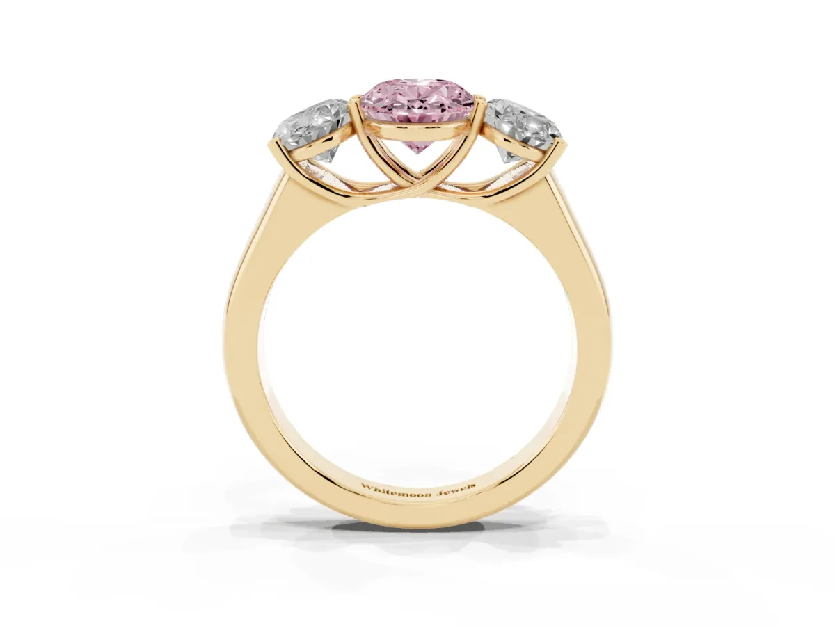 Fancy Pink Oval Cut Three-Stone Diamond Ring with Prong Setting on a Classic Band Yellow gold