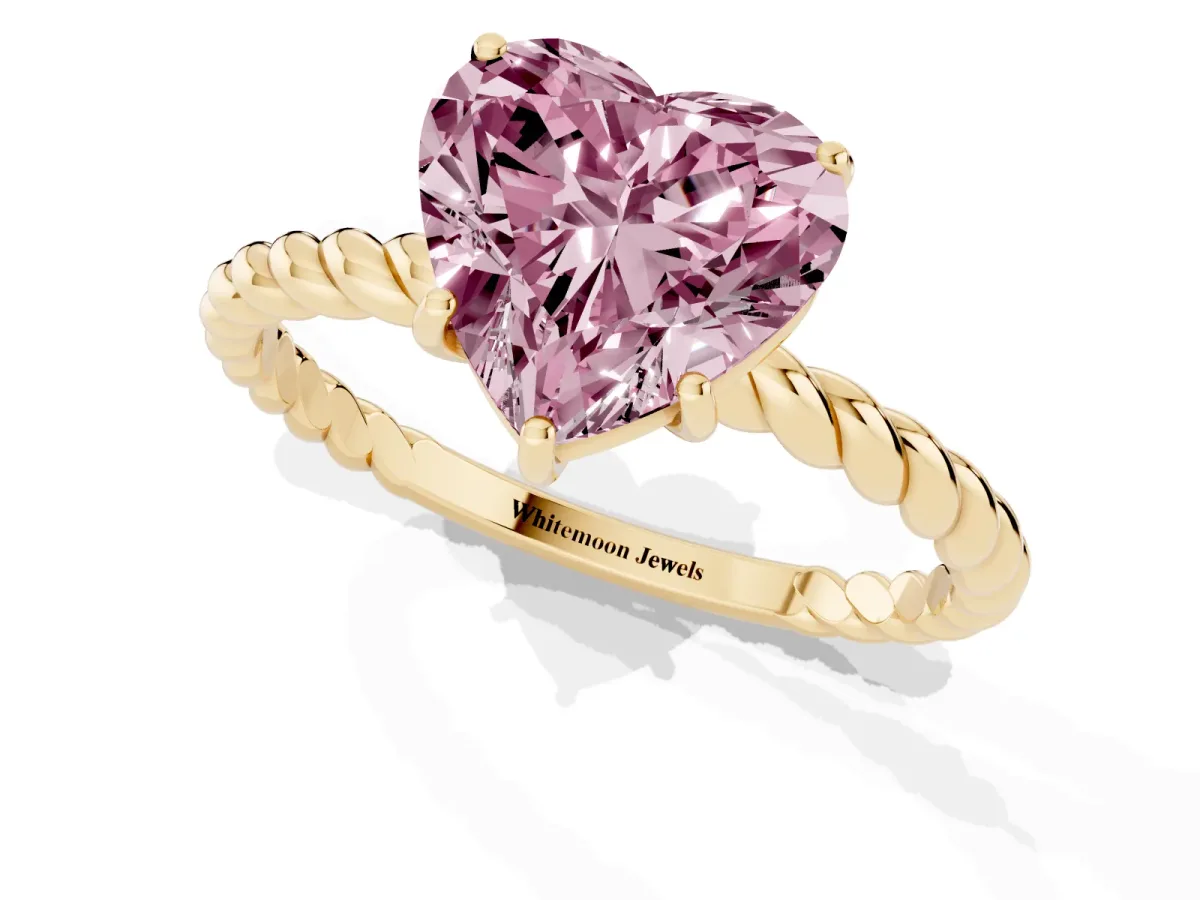 Fancy Pink Heart Cut Solitaire Twist Band Ring with Four-Prong Setting Yellow gold