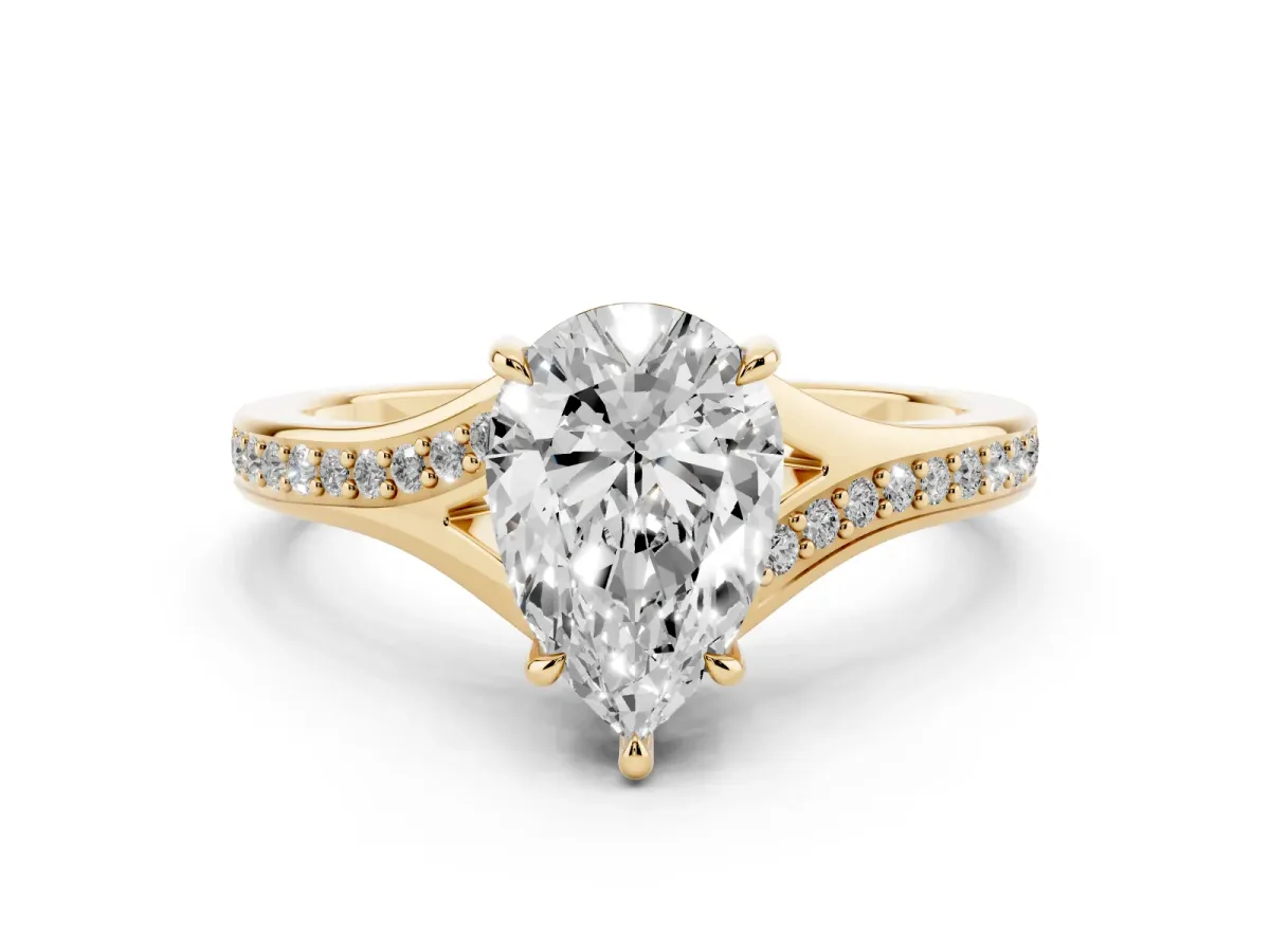 Pear Cut Diamond Solitaire Ring with Pavé Band and Prong Setting Yellow gold