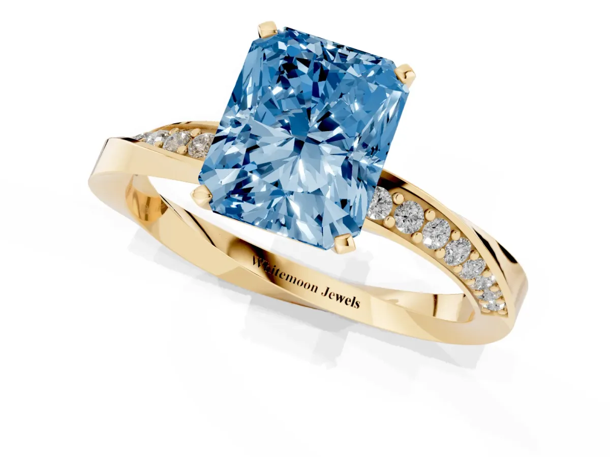 Fancy Blue Radiant Cut Diamond Engagement Ring with Side Stone Accents and Four-Prong Setting Yellow gold