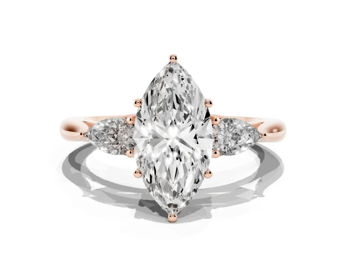 Three-Stone Marquise Cut Diamond Ring with Pear Side Stones in Four-Prong Setting Rose gold