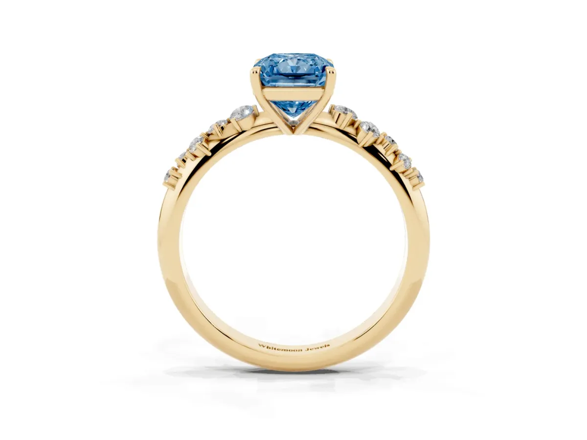 Fancy Blue Radiant Cut Diamond Cluster Side Stone Solitaire Ring with Prong Setting Yellow gold