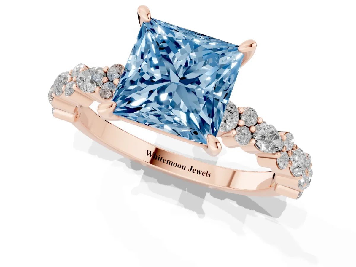 Fancy Blue Princess Cut Diamond Side Stone Solitaire Ring with Round and Four-Prong Setting Rose gold