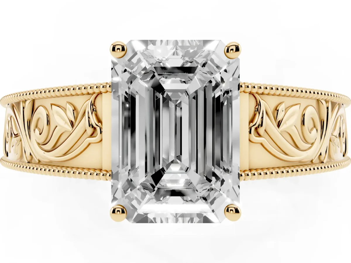 Emerald Cut Diamond Solitaire Ring with Engraved Band and Four-Prong Setting Yellow gold