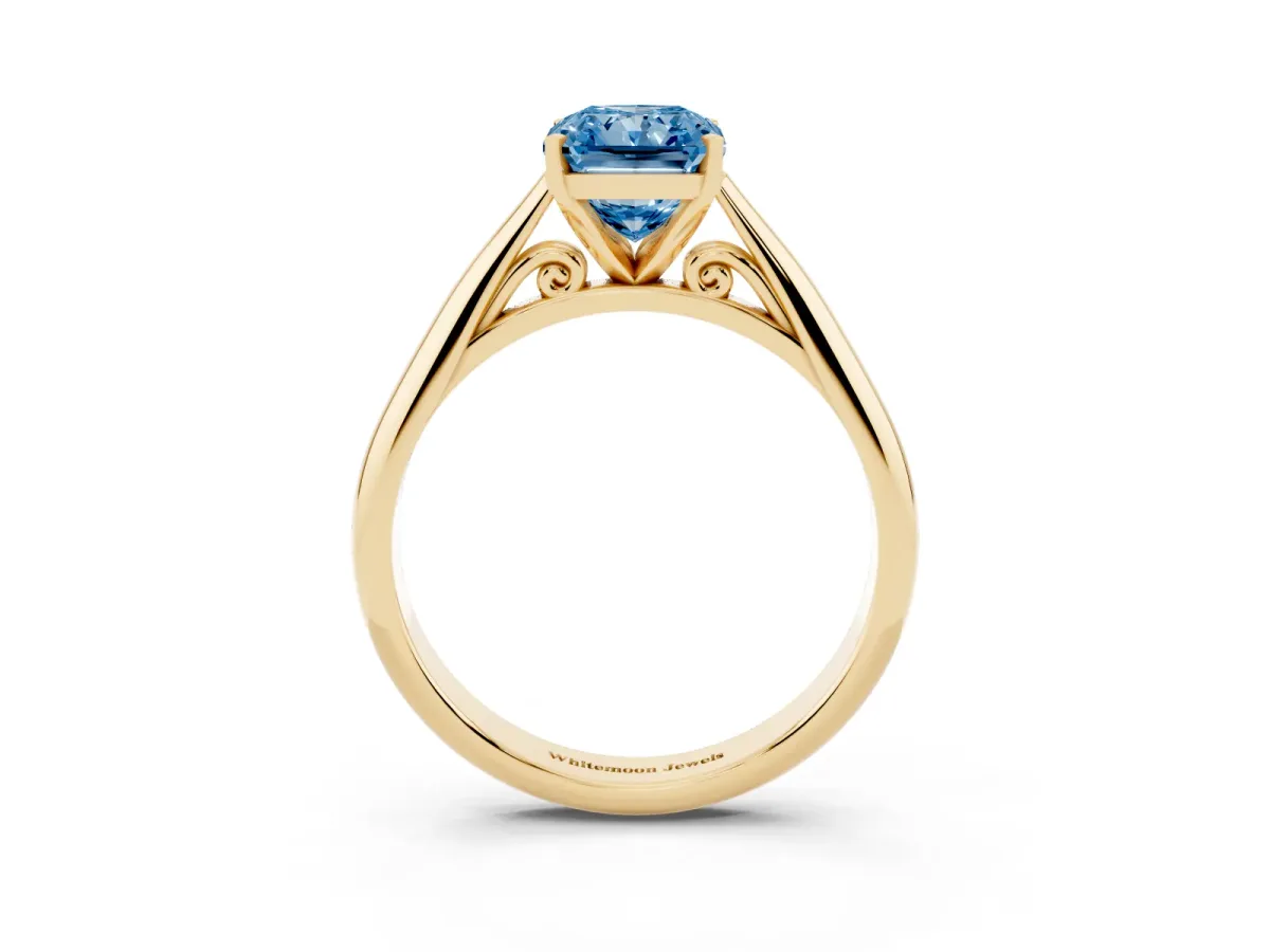 Fancy Blue Radiant Cut Diamond Solitaire Engagement Ring with Cathedral Setting and Four-Prong Mount Yellow gold