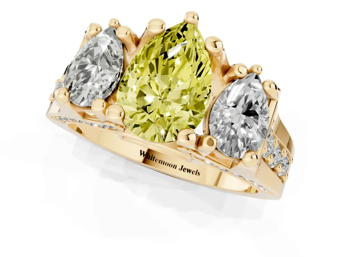Fancy Yellow Pear Cut Diamond Three-Stone Ring with Channel Set Band and Four-Prong Setting Yellow gold