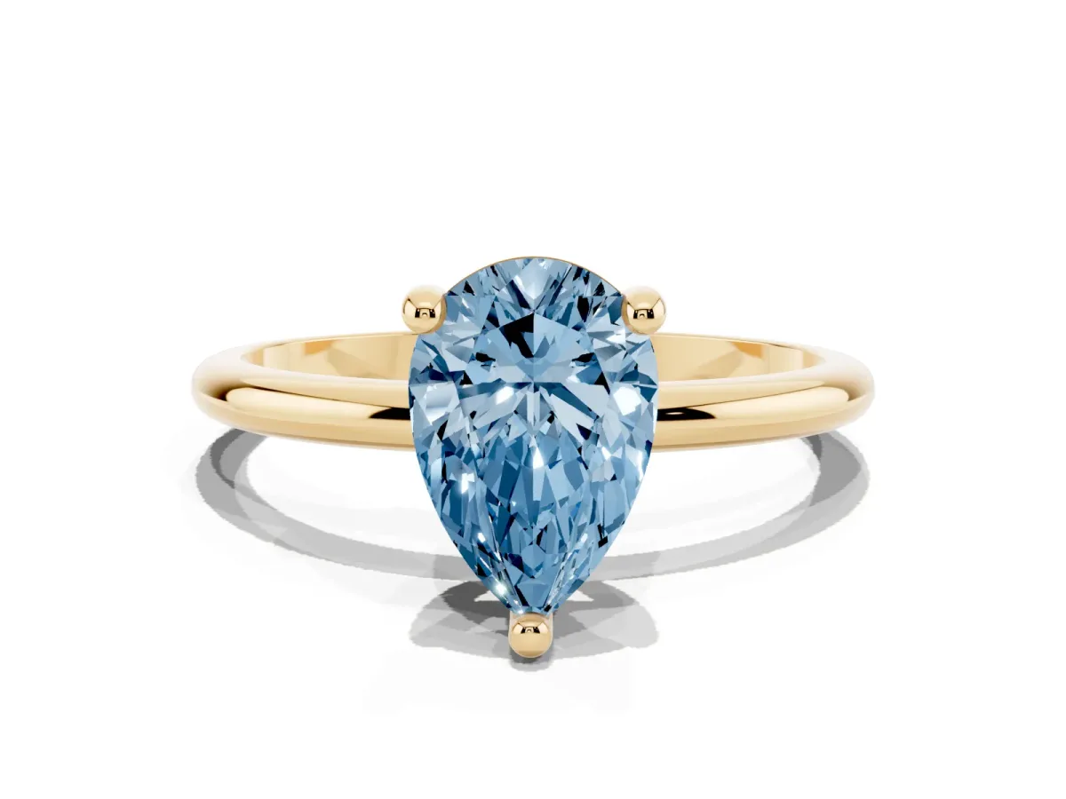 Fancy Blue Pear Cut Solitaire Diamond Ring with 4-Prong Setting on a Classic Band Yellow gold