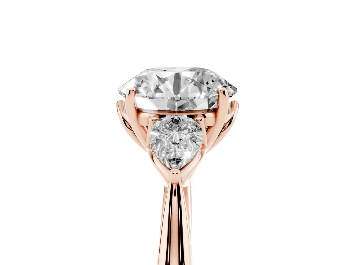 Round Cut Diamond Three-Stone Ring with Pear Side Stones and Prong Setting Rose gold