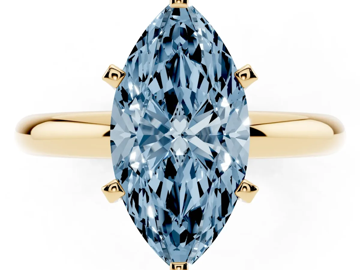 Fancy Blue Marquise Cut Diamond Solitaire Engagement Ring with Round Band and Four-Prong Setting Yellow gold