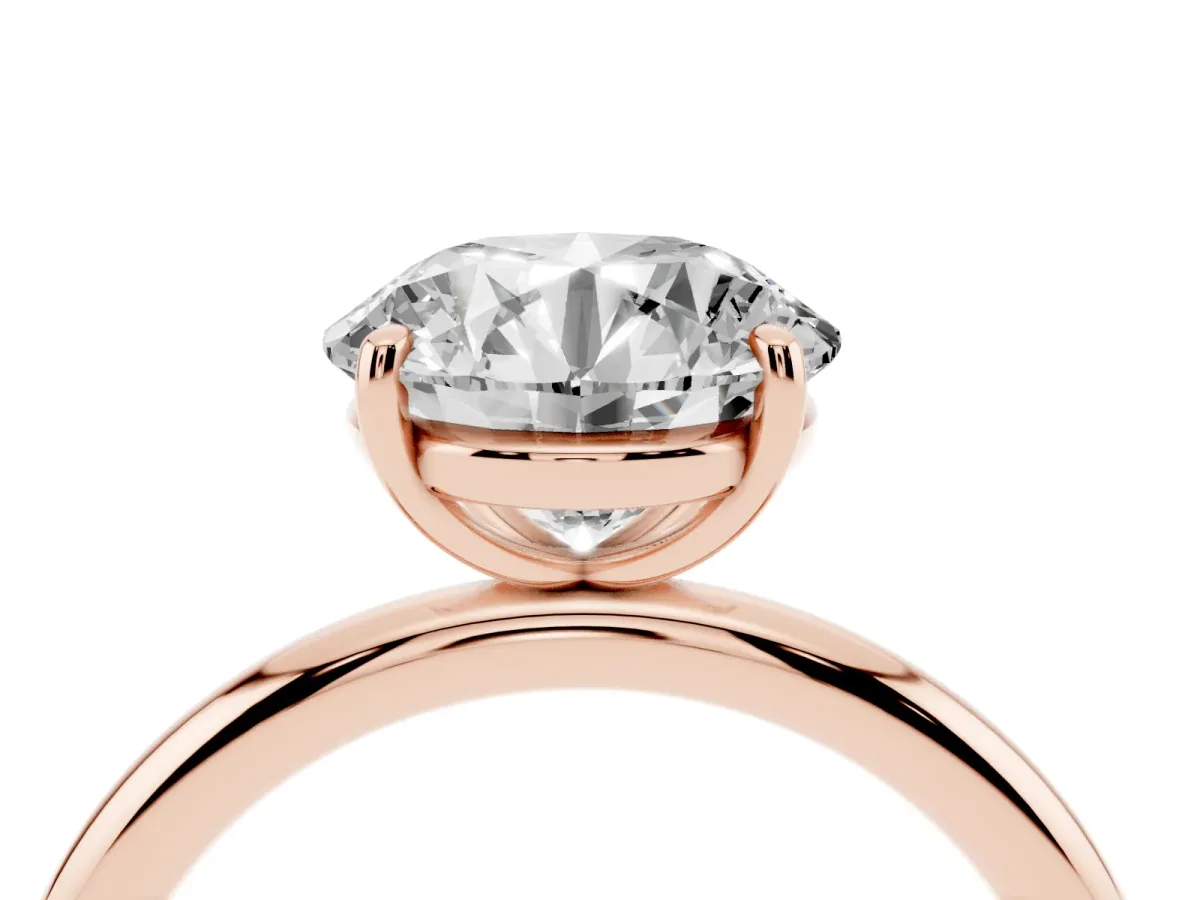 Round Cut Solitaire Diamond Ring with Four-Prong Setting on a Plain Band Rose gold