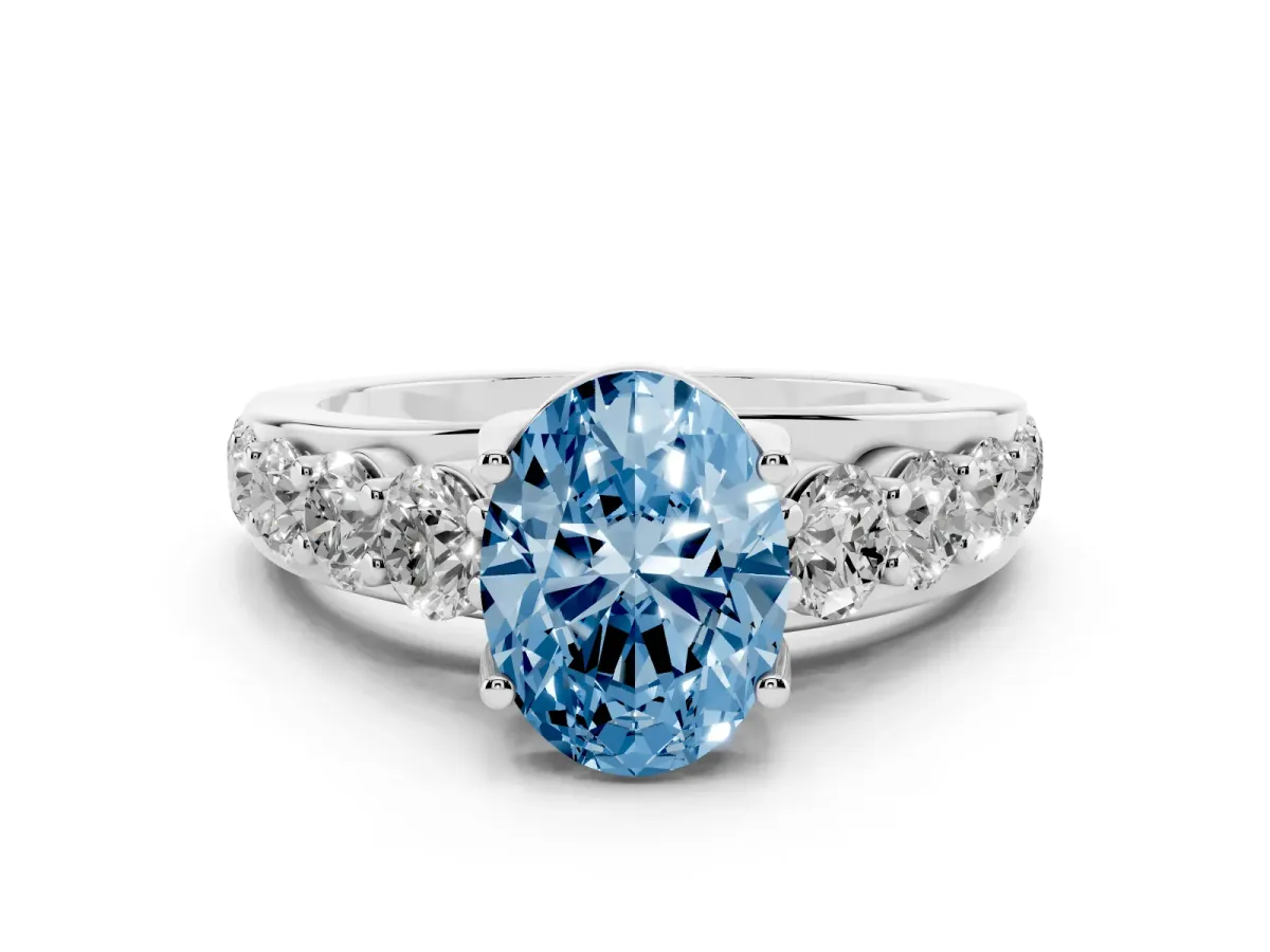 Fancy Blue Oval Cut Diamond Engagement Ring with Pavé Band and Four-Prong Setting Silver