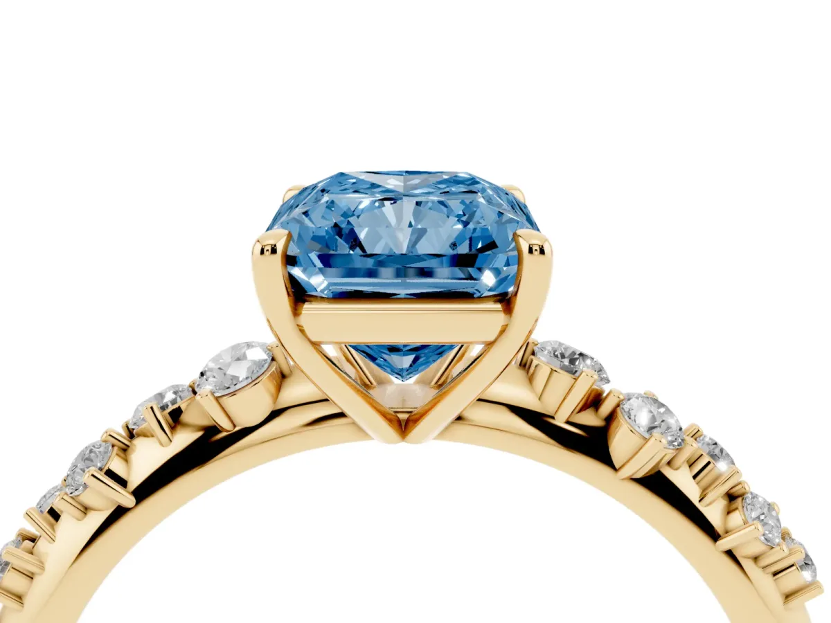 Fancy Blue Radiant Cut Diamond Cluster Side Stone Solitaire Ring with Prong Setting Yellow gold
