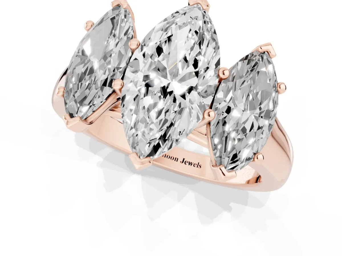Marquise Cut Three-Stone Diamond Ring with Prong Setting on a Classic Band Rose gold