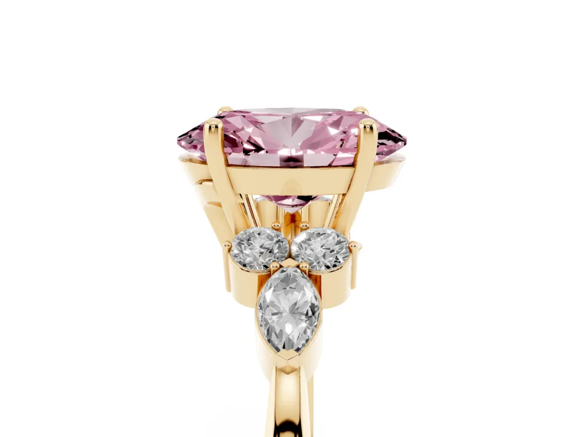 Fancy Pink Oval Cut Brilliant Diamond Solitaire Ring with Pear Side Stones and Four-Prong Setting Yellow gold