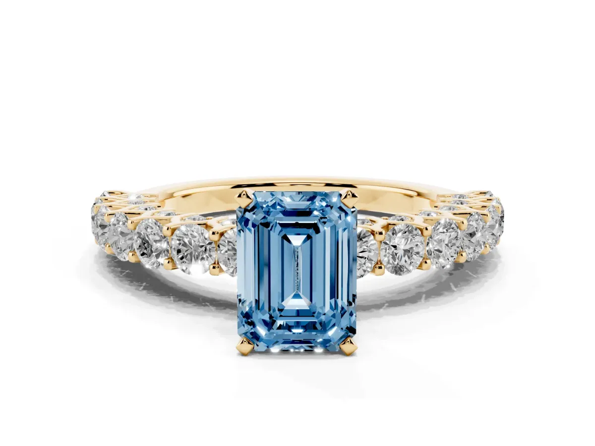 Fancy Blue Emerald Cut Diamond Solitaire Ring with Shared Prong Pavé Band and Four-Prong Setting Yellow gold