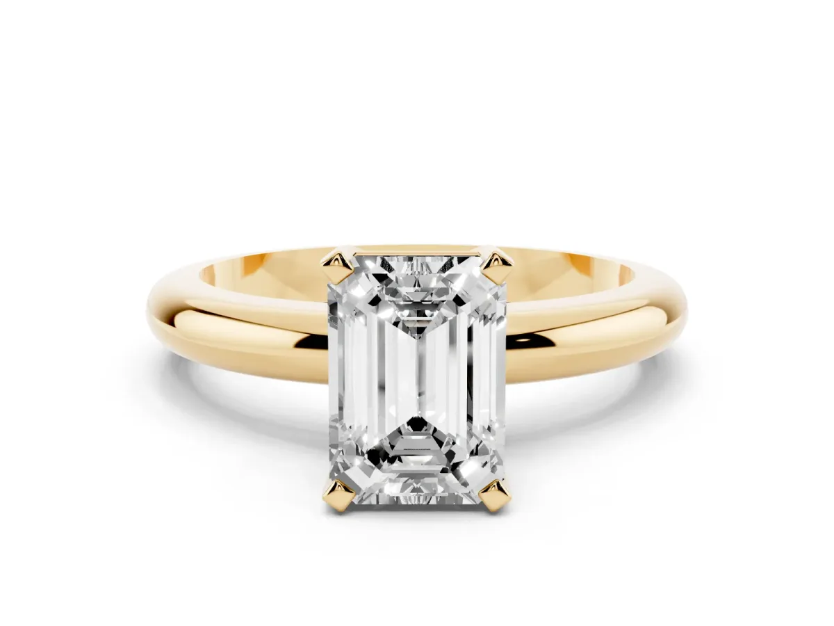 Emerald Cut Diamond Solitaire Engagement Ring with Round Band and Four-Prong Setting Yellow gold