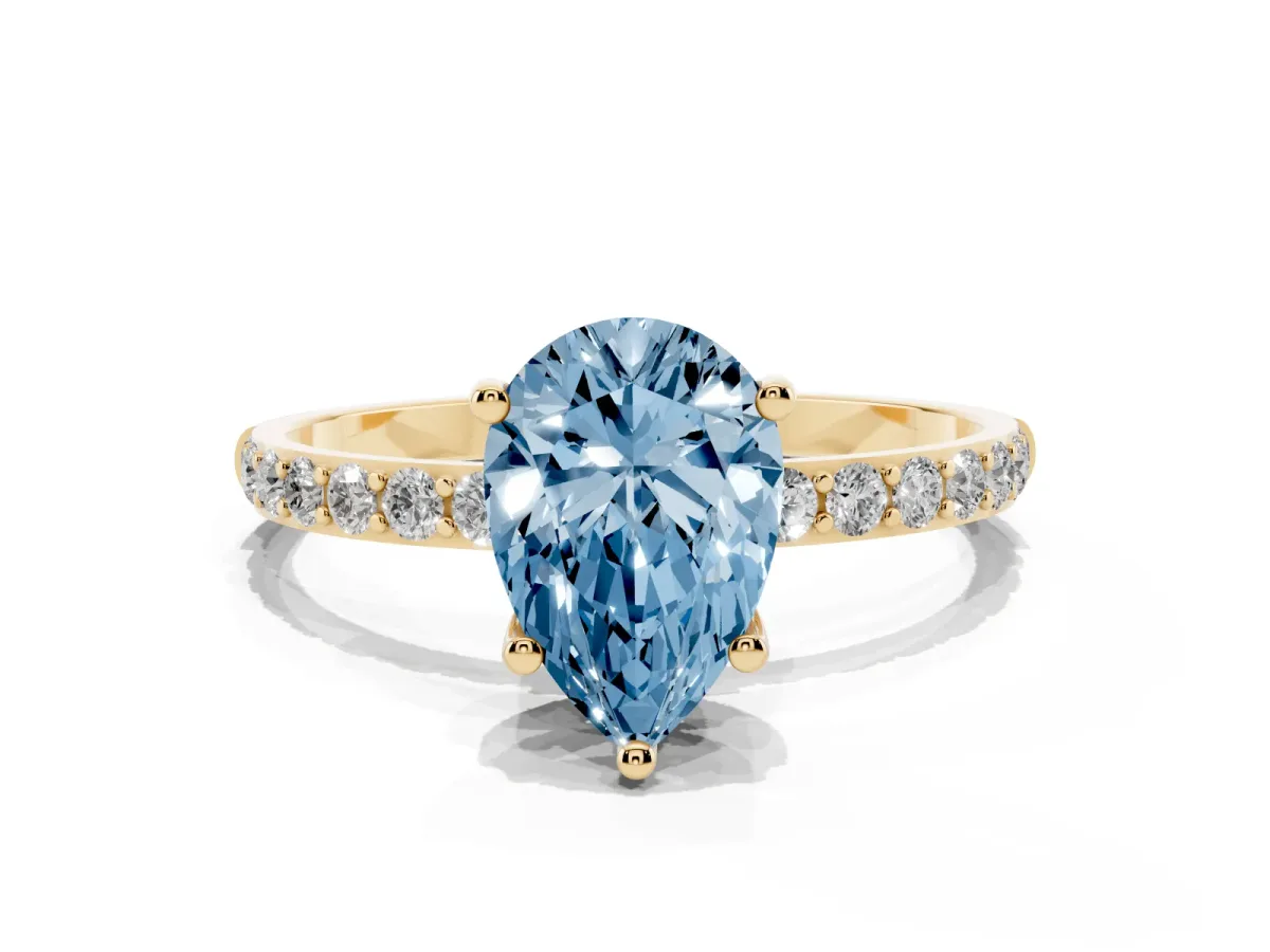 Fancy Blue Pear Cut Diamond Solitaire Ring with Round Pavé Shoulders and Prong Setting Yellow gold