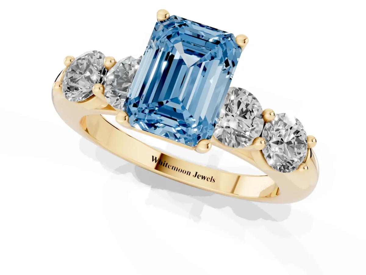 Fancy Blue Emerald Cut Cut Five-Stone Prong Set Diamond Ring with Classic Band Yellow gold