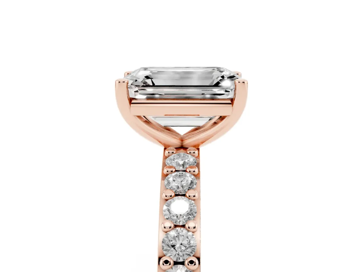 Emerald Cut Cut Diamond Solitaire with Pave Band and Four-Prong Setting Rose gold