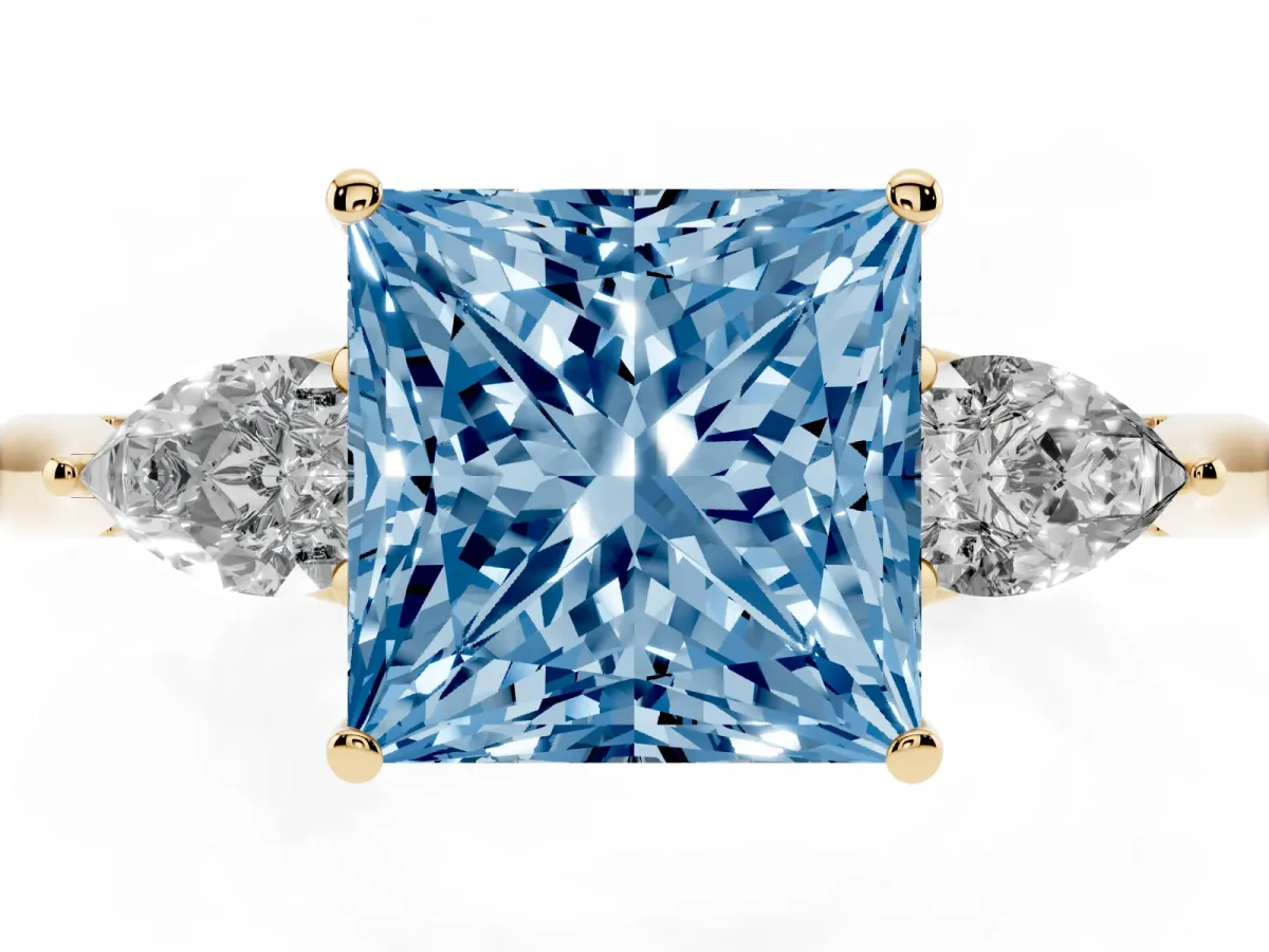 Fancy Blue Three-Stone Princess Cut Diamond Ring with Pear Side Stones in Four-Prong Setting Yellow gold