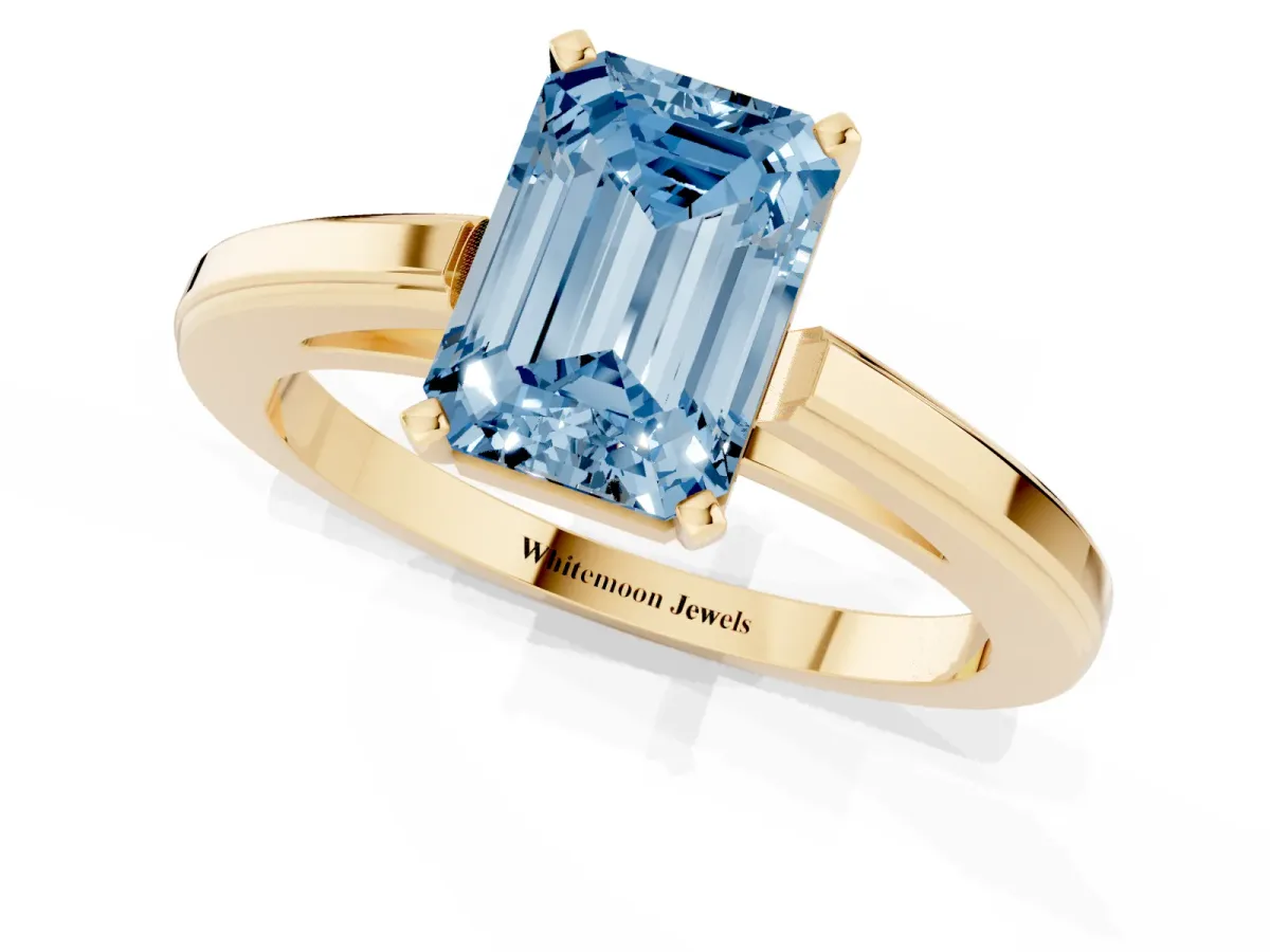 Fancy Blue Emerald Cut Solitaire Diamond Ring with Four-Prong Setting and Classic Band Yellow gold